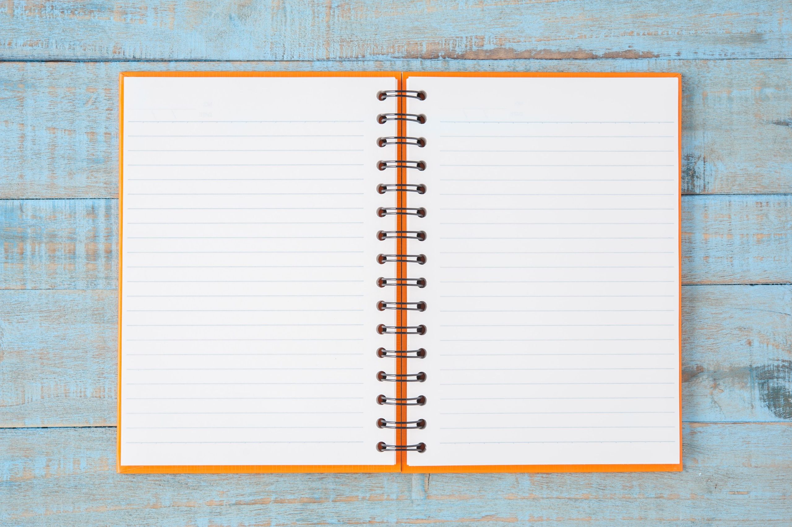 notebook-on-blue-wood-table (1)