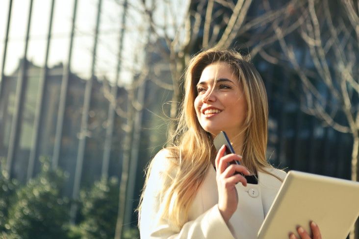 A university student with her notes in her hand before using one of the best apps: Notion.